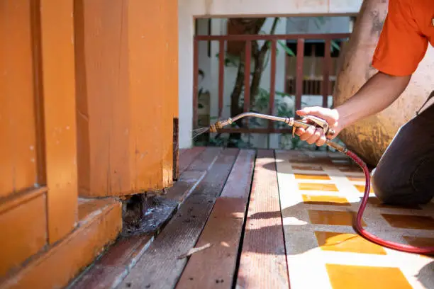 Technician preparing a bed bug heat treatment in an Akron home
